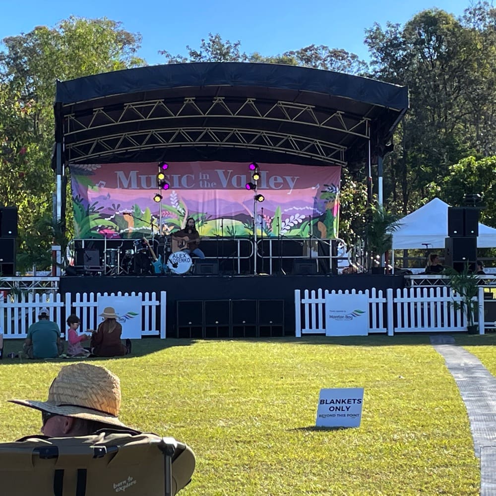 Solo musician on outdoor stage. Live event audio Brisbane, Gold Coast, Sunshine Coast