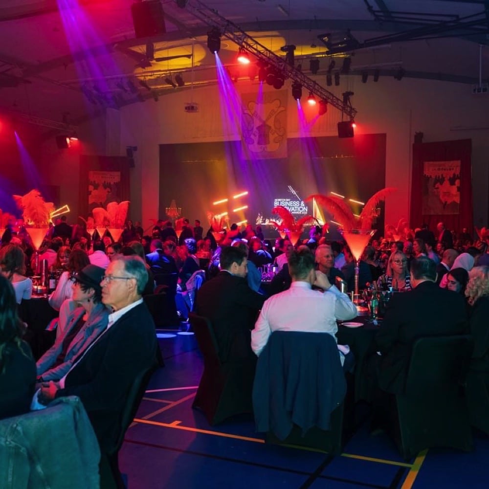 Awards Dinner Moreton Bay Business and Innovation. People sitting hall around table having dinner. Live event audio Brisbane, Gold Coast, Sunshine Coast